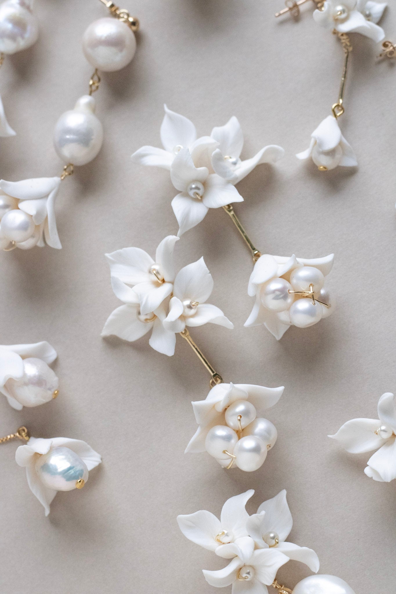 a collection of flower clay earrings by megan therese