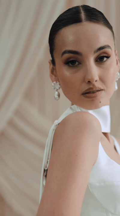 Bride wearing statement pearl wedding earrings by Megan Therese