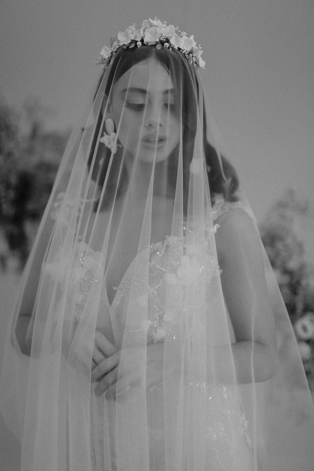 bridal crown and statement wedding earrings by megan therese