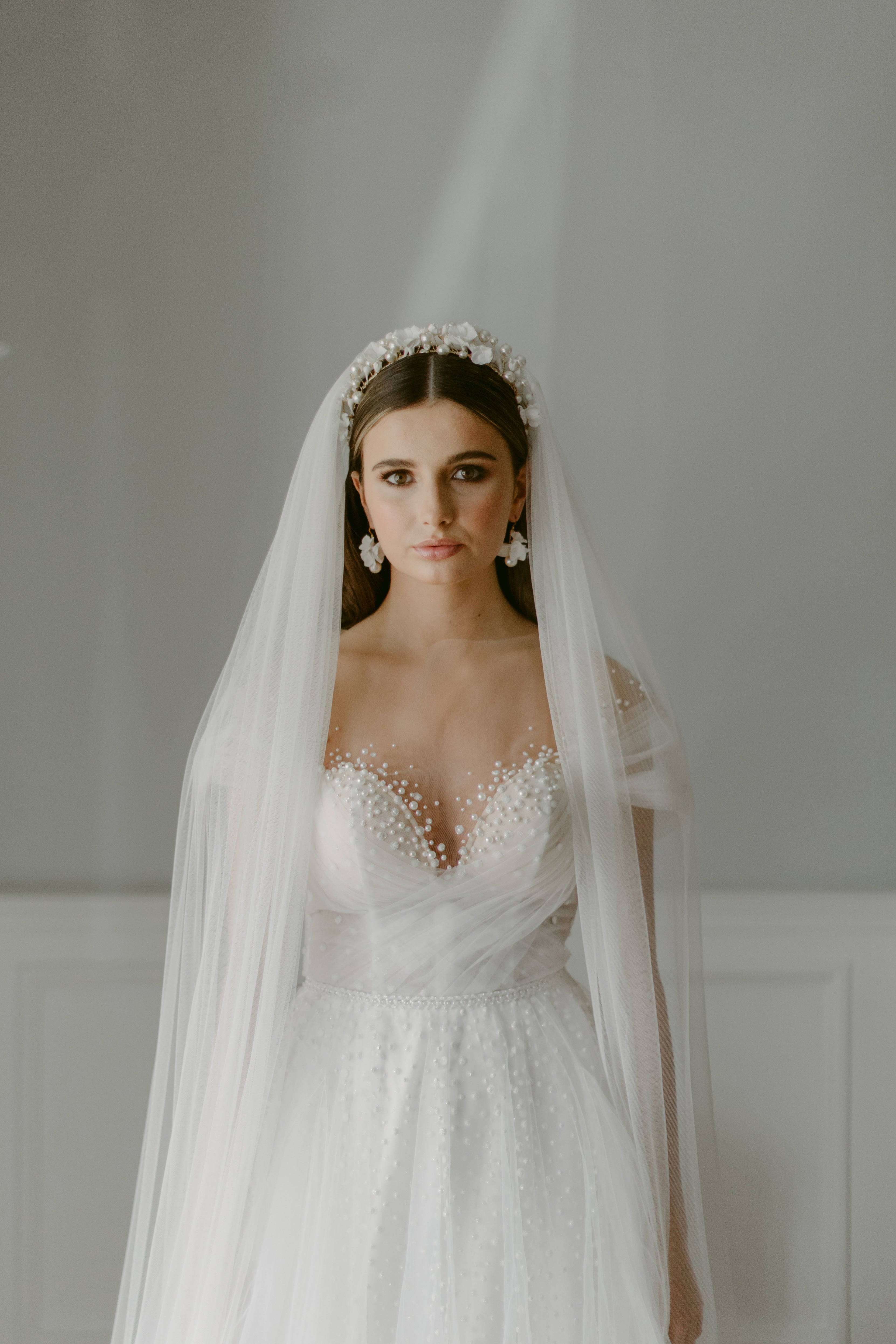 bride wearing soft veil and wedding crown by megan therese