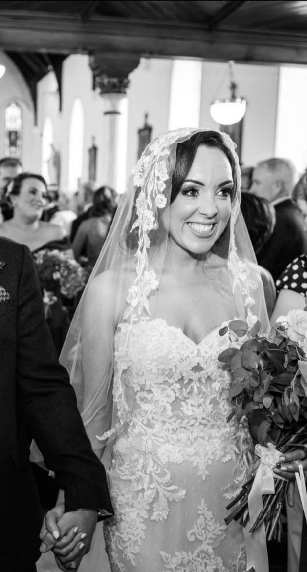 bride wearing bespoke lace mantilla veil