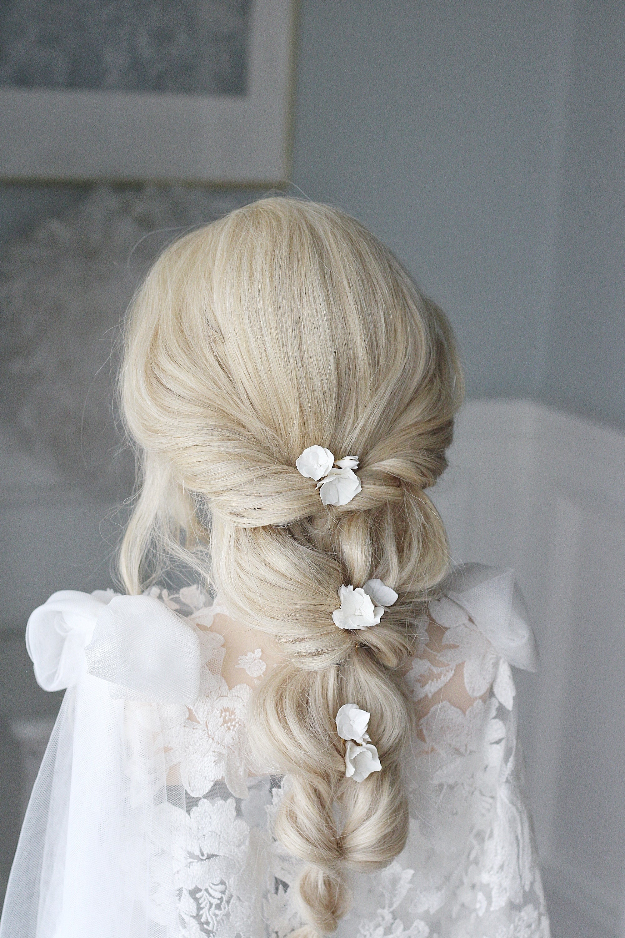 long bridal hair fishtail braid with bridal accessories