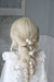 long bridal hair fishtail braid with bridal accessories