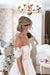 real bride wearing flower clay earrings by megan therese